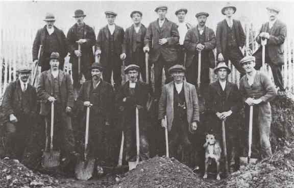 Men working on the road, with shovels, Keynsham